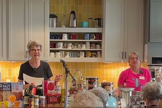 Norma Martin and Sally Sharrard demonstrating Emergency Food Preparedness