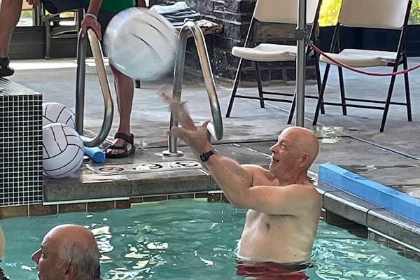 John Chapman playing water volleyball