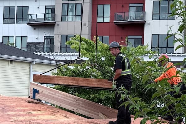 Worker on roof.